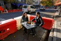 Ranim Abaad and Joey Bettencourt, right, have lunch at the RIND in Sacramento, Calif., Friday, ...