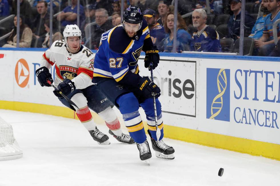 In this March 9, 2020, file photo, St. Louis Blues' Alex Pietrangelo (27) and Florida Panthers' ...