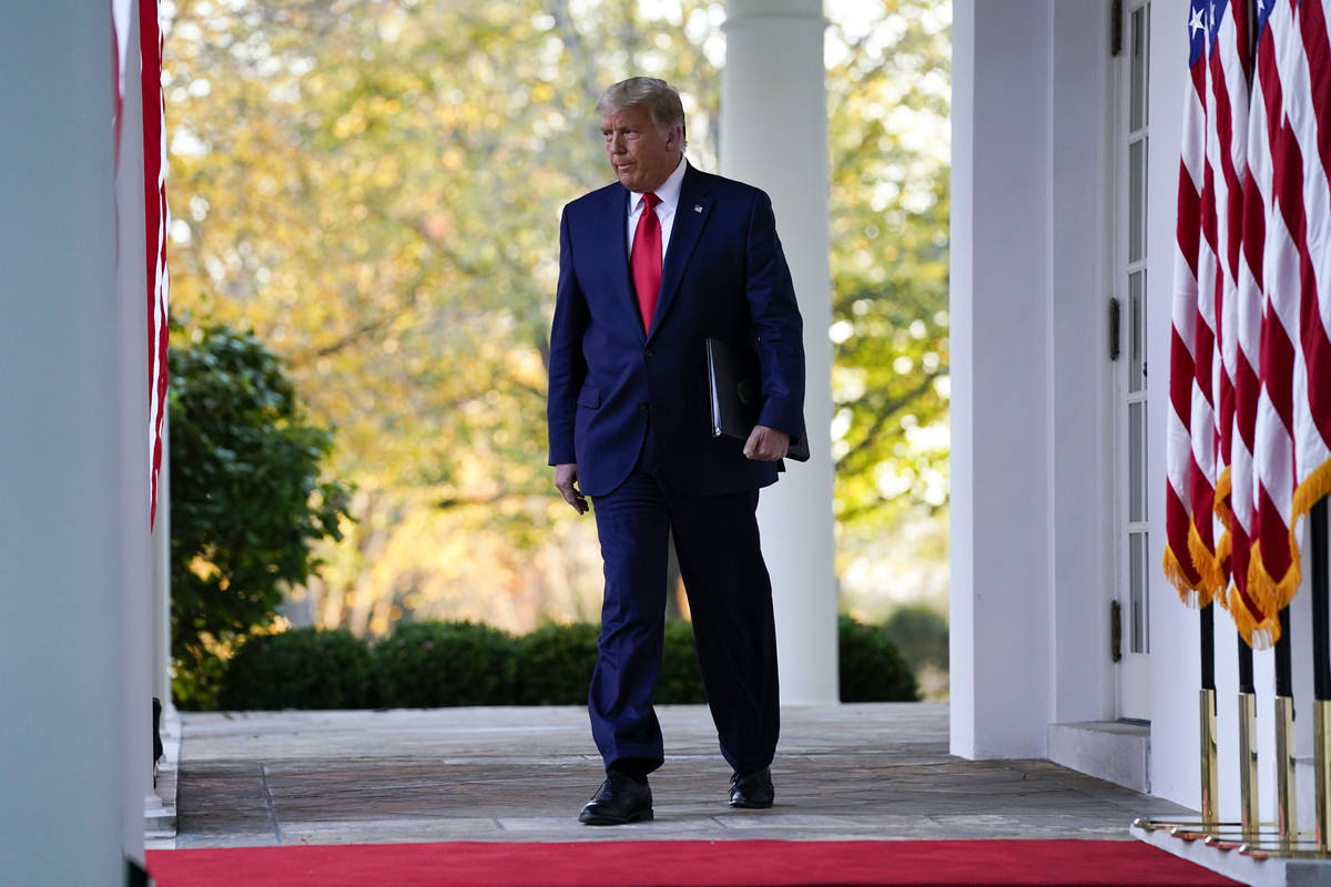 President Donald Trump arrives to speak in the Rose Garden of the White House, Friday, Nov. 13, ...