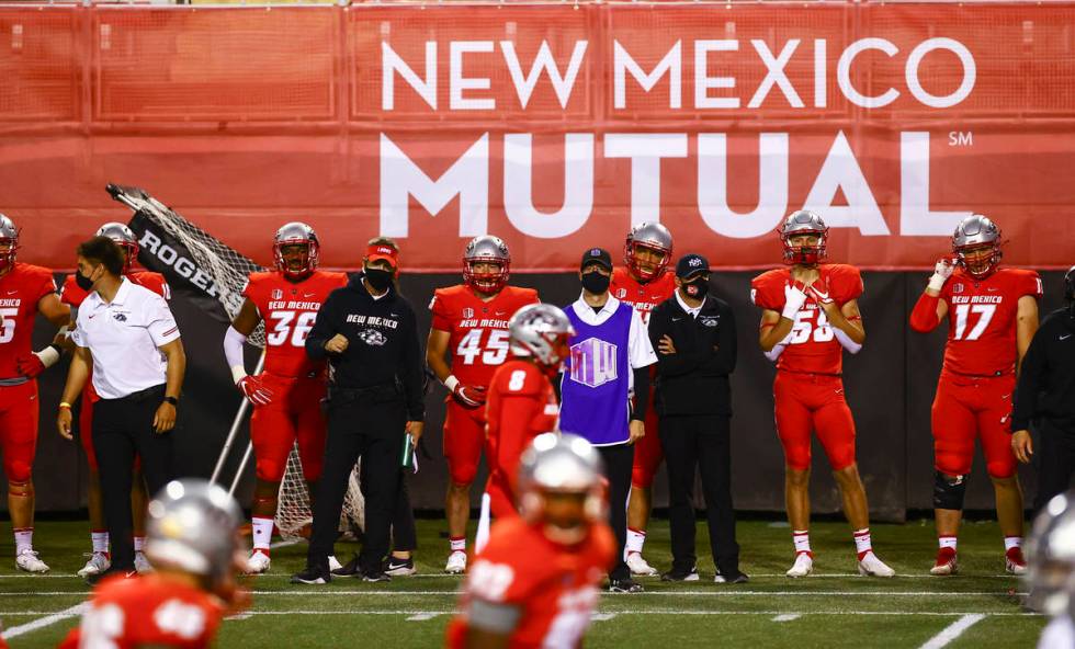 New Mexico Lobos players and staff look on as they play UNR during the second half of a footbal ...
