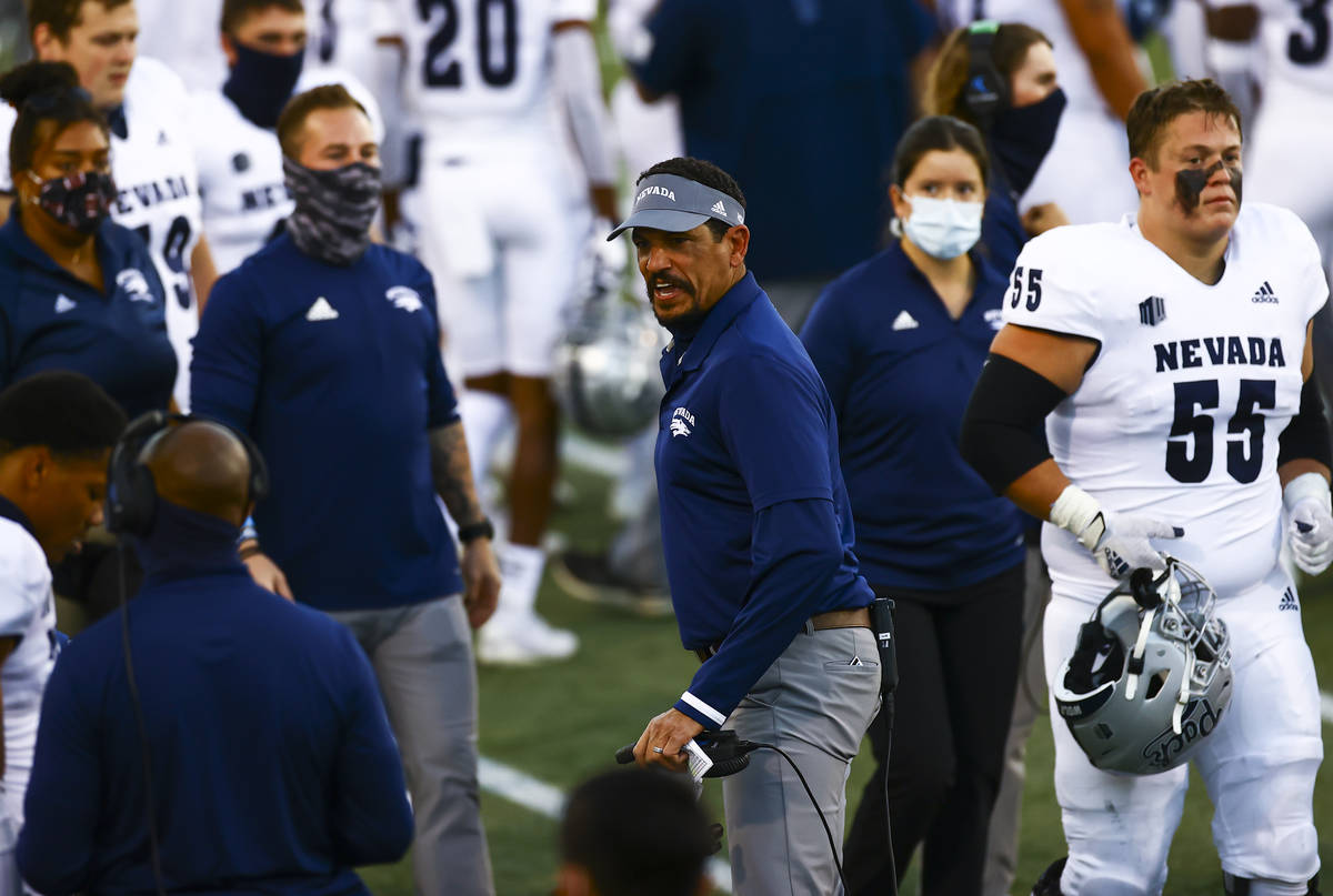 UNR Wolf Pack head coach Jay Norvell shouts toward a player during the first half of a football ...