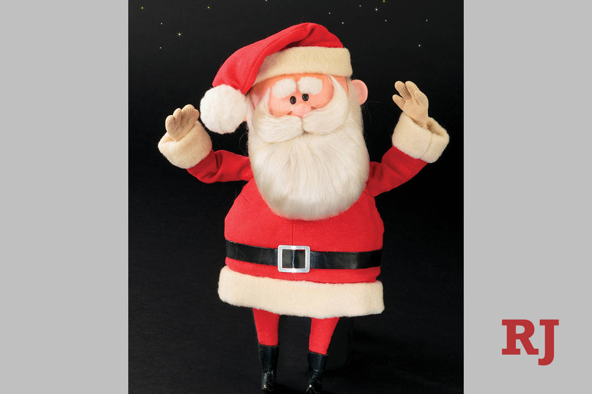 This image released by Profiles in History shows a Santa Claus puppet used in the filming of th ...