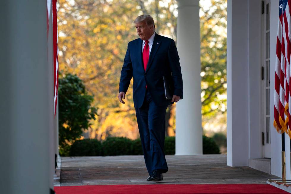 President Donald Trump arrives to speak in the Rose Garden of the White House, Friday, Nov. 13, ...