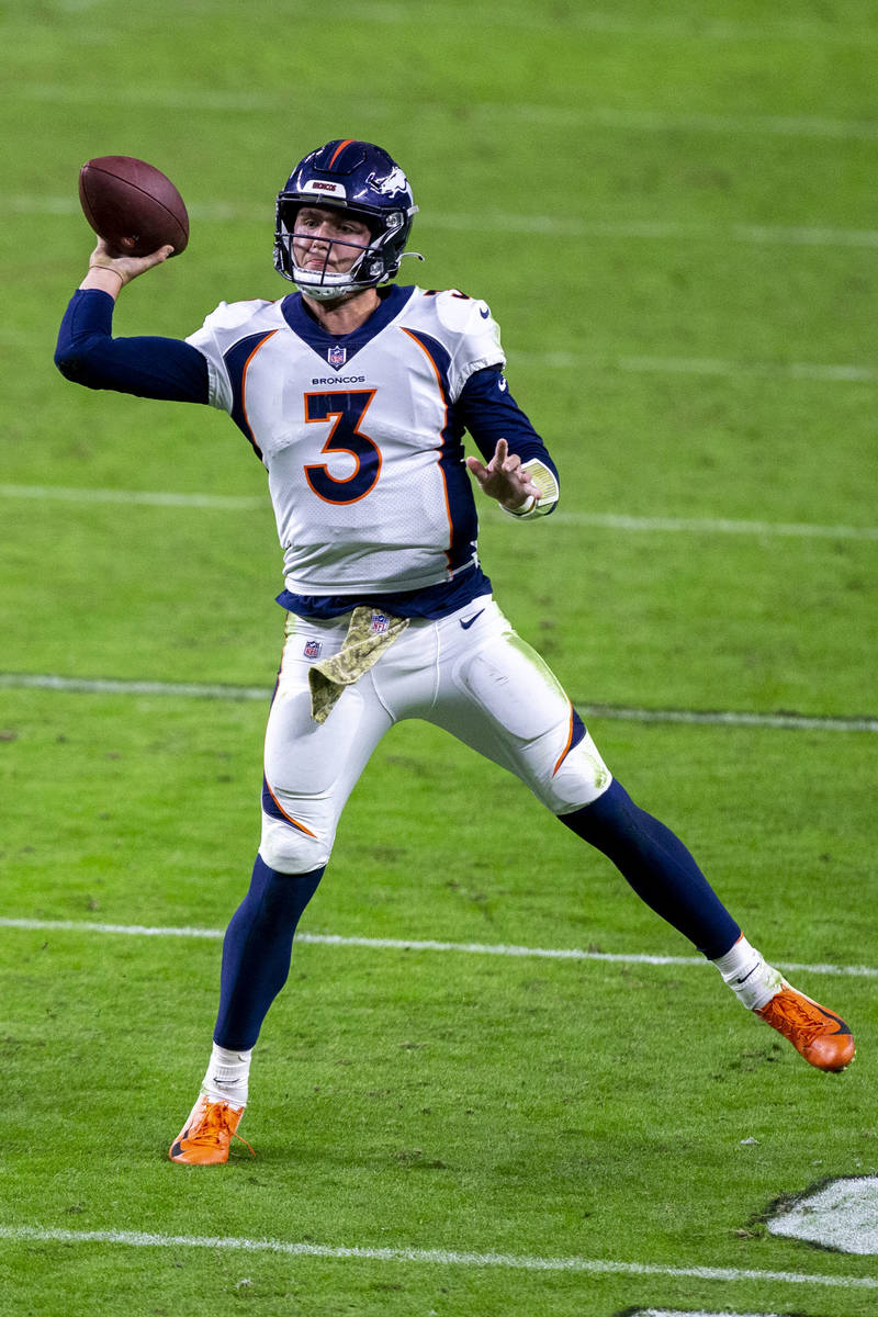 Denver Broncos quarterback Drew Lock (3) prepares to throw against the Las Vegas Raiders during ...