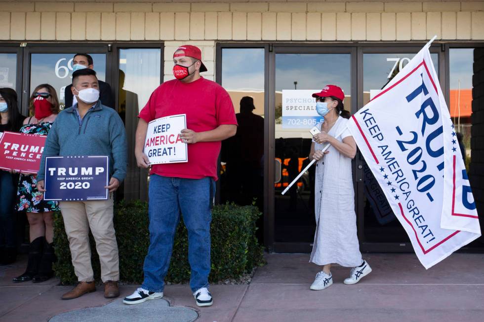Supporters of Donald Trump attend a Nevada GOP press conference announcing a new elections laws ...