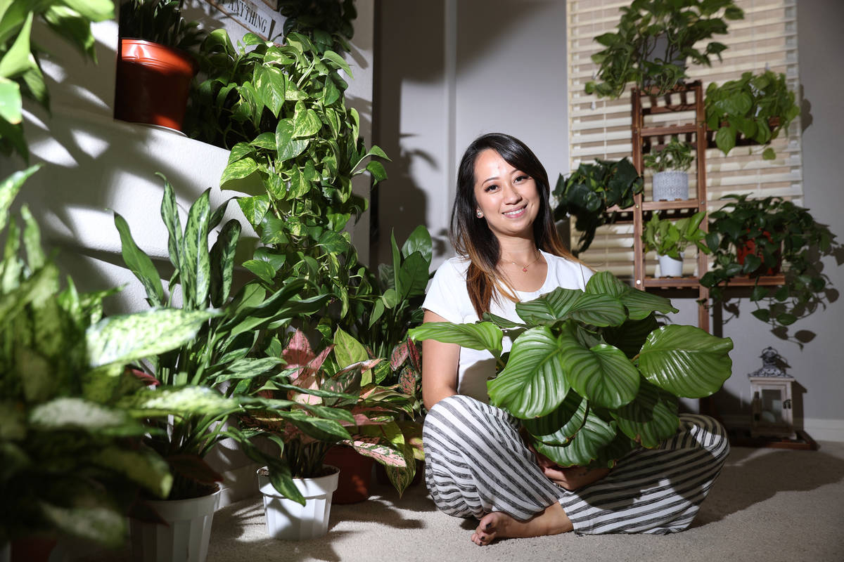 Plant enthusiast Clariselle Felias poses for a portrait at her home in Las Vegas on Thursday, N ...