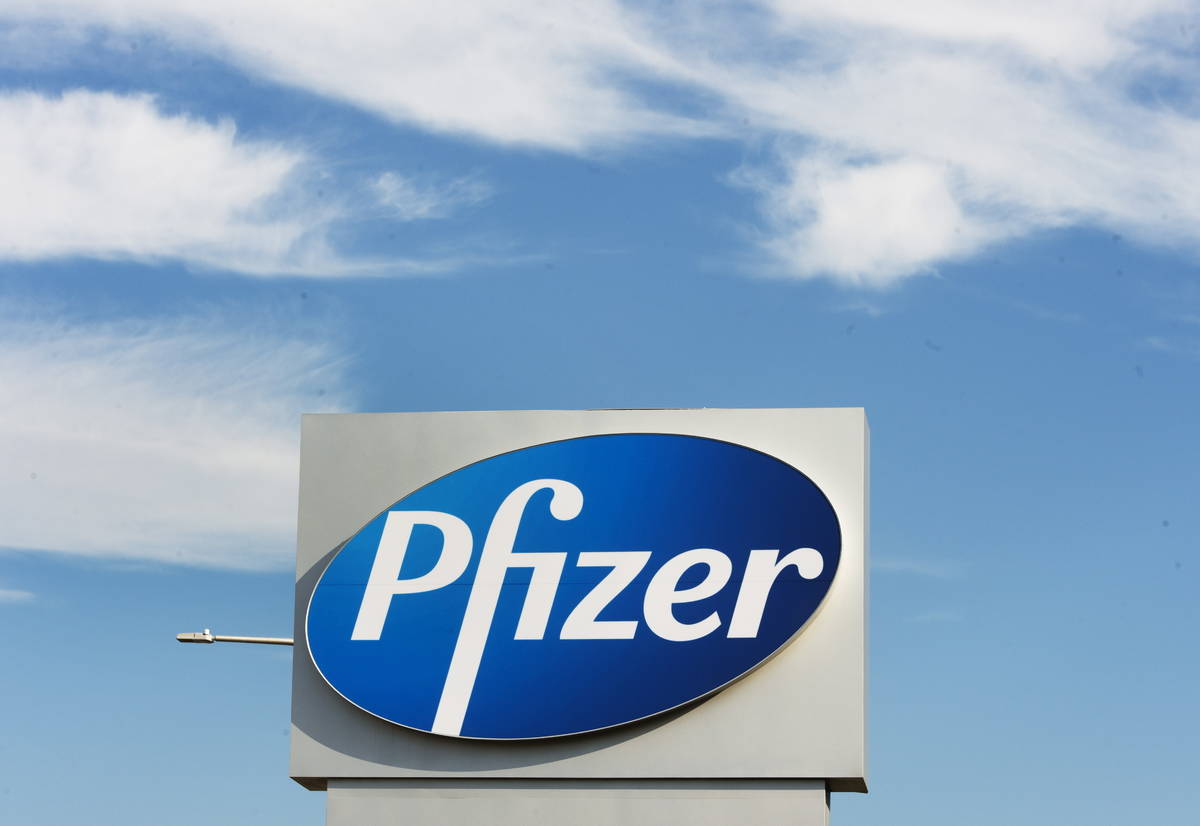 In this Monday, Nov. 9, 2020, file photo, a sign with the Pfizer logo stands outside the corpor ...