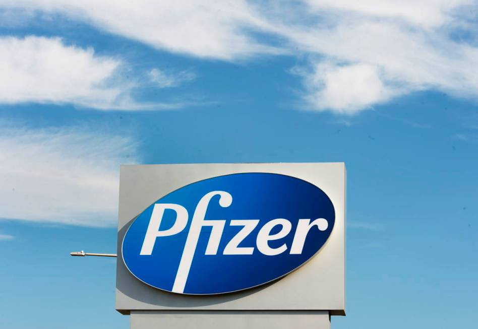 In this Monday, Nov. 9, 2020, file photo, a sign with the Pfizer logo stands outside the corpor ...