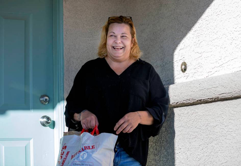 Heaven Burns, 50, of North Las Vegas, receives a holiday inspired New York Strip meal created b ...