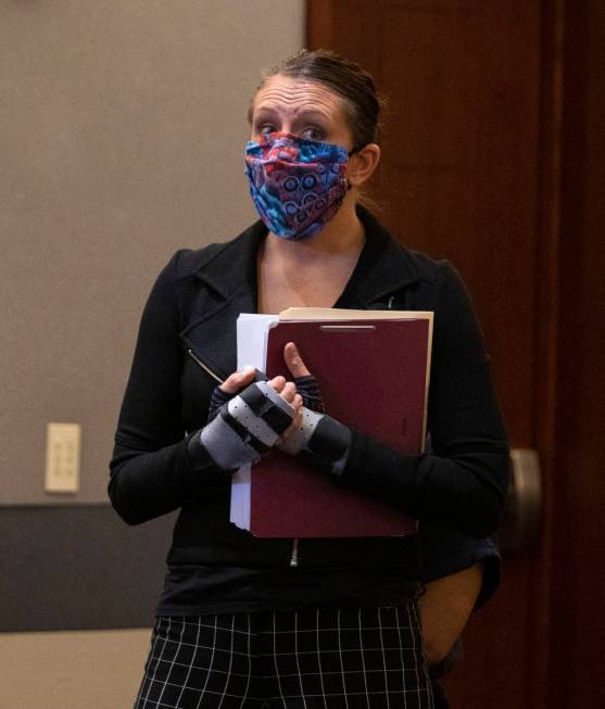 Attorney Sarah Hawkins shields her client, Amanda Sharp-Jefferson, charged with murder in conne ...