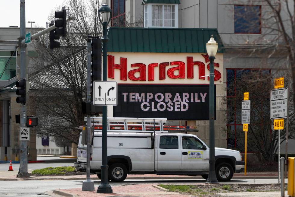 A marquee sign reminds residents of Joliet, Ill., that Harrah's Casino on the Des Plaines River ...