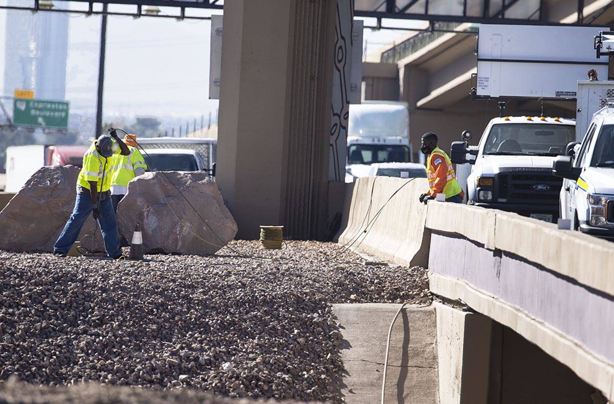 Workers from the Nevada Department of Transportation (NDOT) replace copper wire after Spaghetti ...