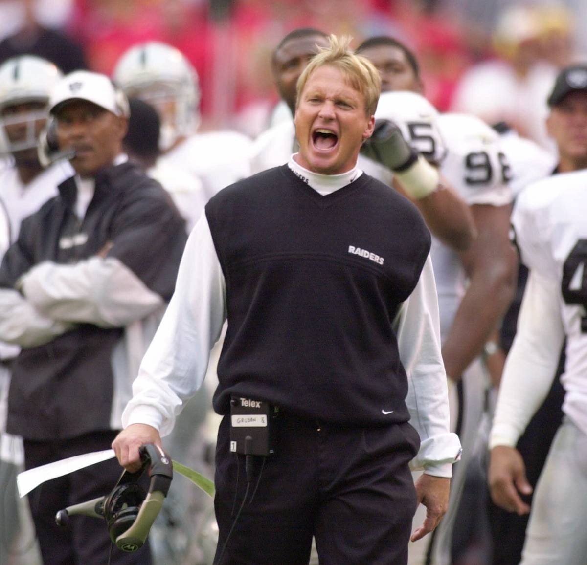 Oakland Raiders coach Jon Gruden yells to his team while officials review a play in the second ...