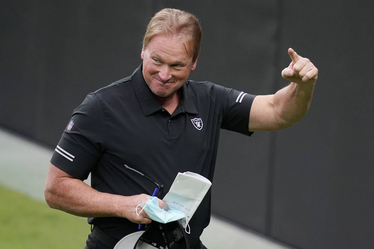 Las Vegas Raiders head coach Jon Gruden reacts during an NFL football training camp practice Fr ...