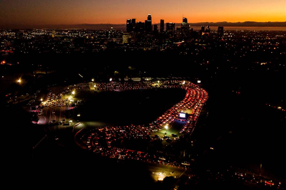 In this Nov 18, 2020, file photo, motorists wait in long lines to take a coronavirus test in a ...