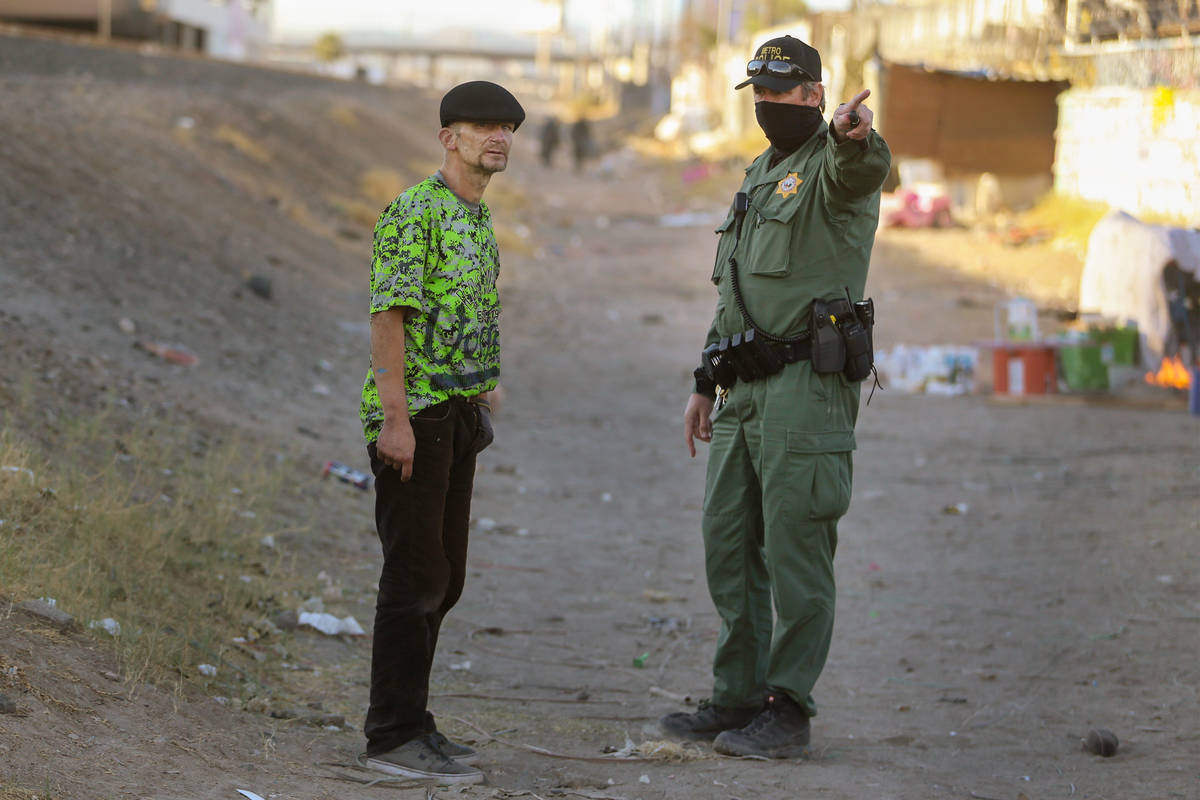 Officer Walter Tlockowski, right, with the Metropolitan Police Department's Homeless Outreach T ...