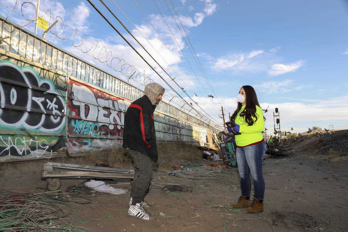 Case manager Christina Harrington, right, with Westcare, checks in with Tony Loureiro along the ...