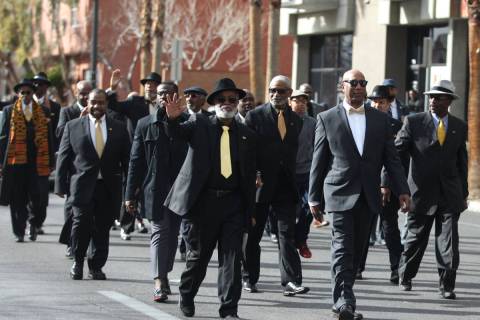 Members of the 100 Black Men of Las Vegas organization participate during the 38th annual Dr. M ...