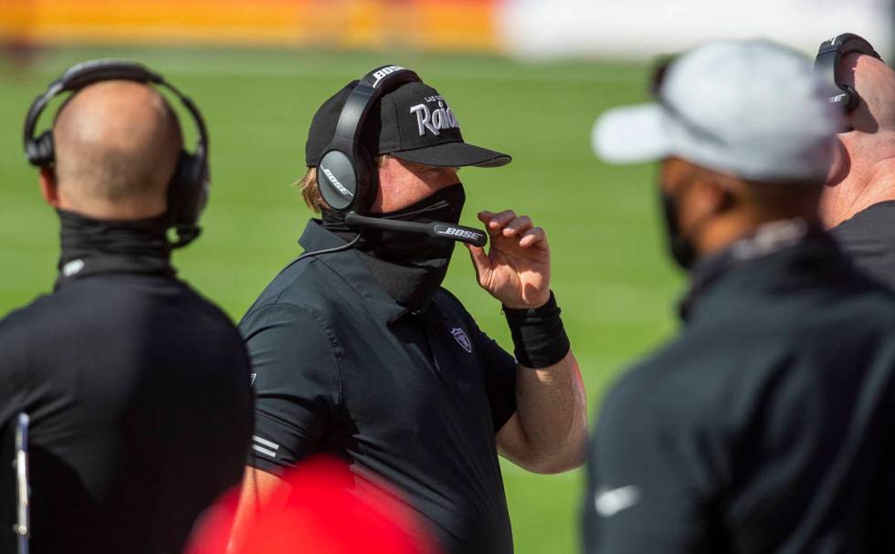 Las Vegas Raiders head coach Jon Gruden coaches from the sideline during the 1st quarter of an ...