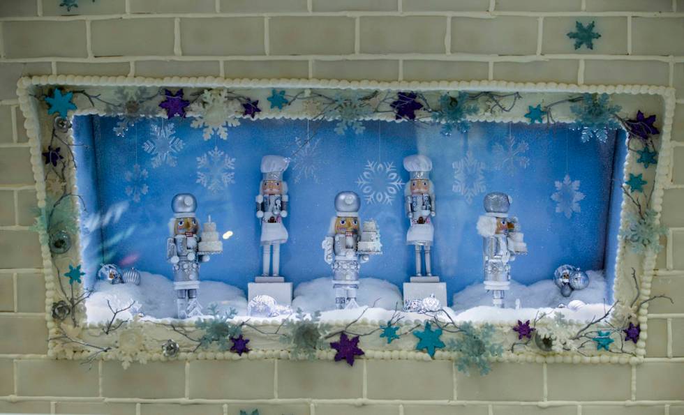 Nutcrackers spin in a picture window at Aria's Sugar Palace lobby display unveiled today in Las ...