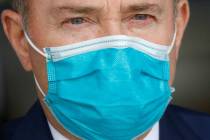 Utah Gov. Gary Herbert wears a mask during a news conference in Salt Lake City in April 2020. ...