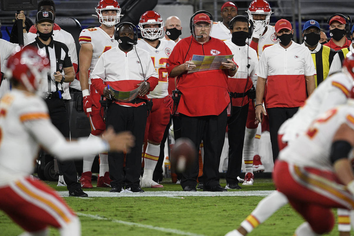 Kansas City Chiefs head coach Andy Reid watches his team during the first half of an NFL footba ...