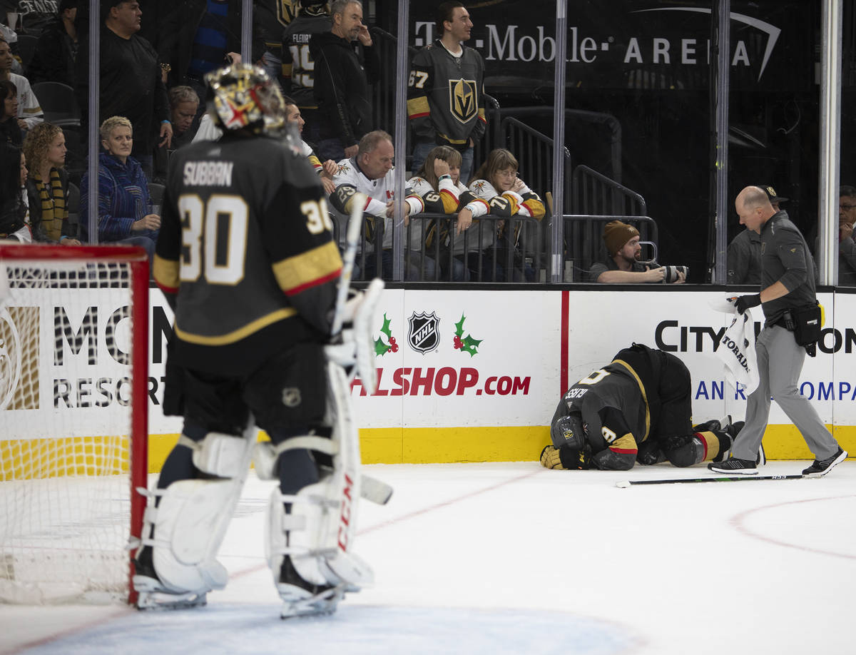 Vegas Golden Knights center Cody Glass (9) crouches in pain during the second period of the gam ...