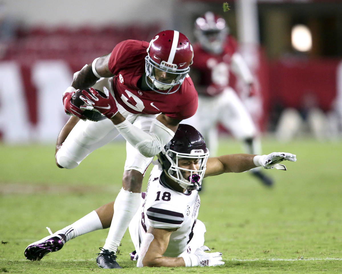 Alabama defensive back Patrick Surtain II (2) makes an interception that he returned for a touc ...