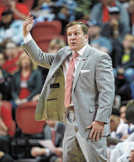 UNLV head coach T. J. Otzelberger coaches against Kansas State in an NCAA college basketball ga ...