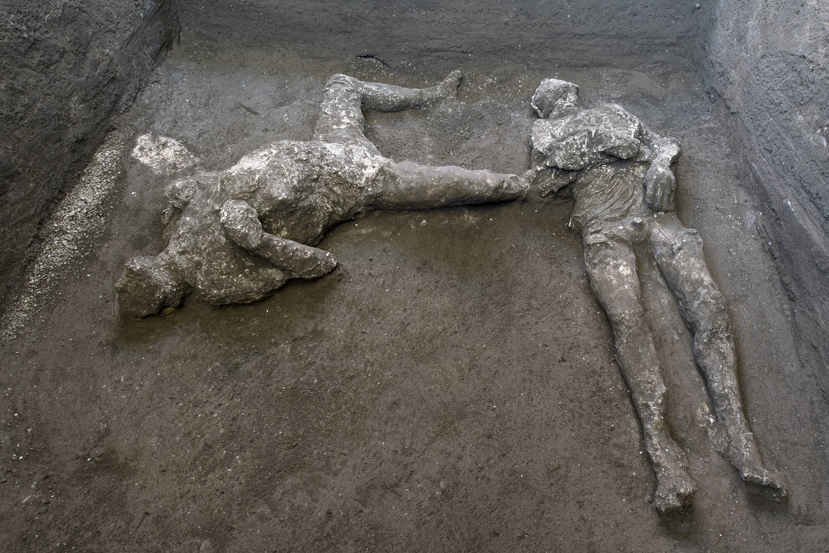 The casts of what are believed to have been a rich man and his male slave fleeing the volcanic ...