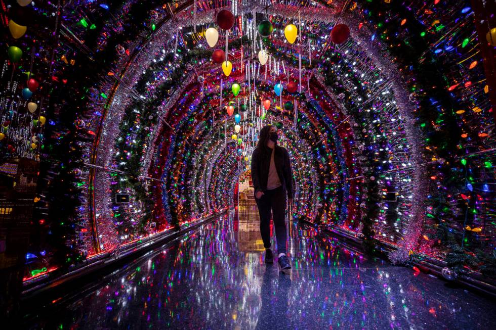 Katrina Albana walks through a hallway lit with thousands of bulbs leading to the main lounge a ...