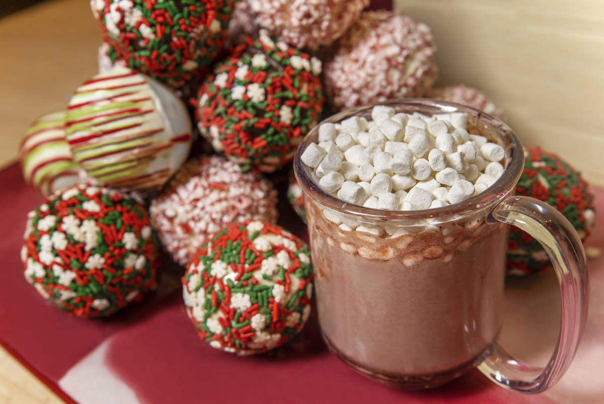 Extra marshmallows are added to a cocoa bomb, 8 oz. of boiling milk and 2 oz. of Captain Morgan ...