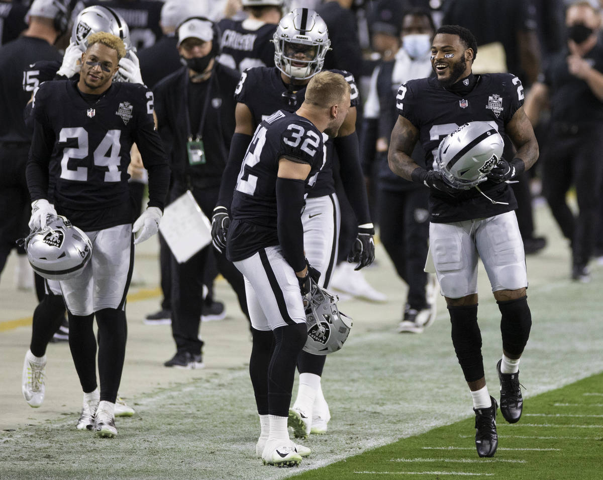 Las Vegas Raiders cornerback Keisean Nixon (22) celebrates a big defensive stop with teammates ...