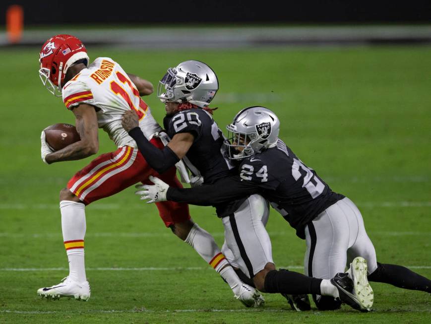 Las Vegas Raiders cornerback Damon Arnette (20) and Las Vegas Raiders strong safety Johnathan A ...