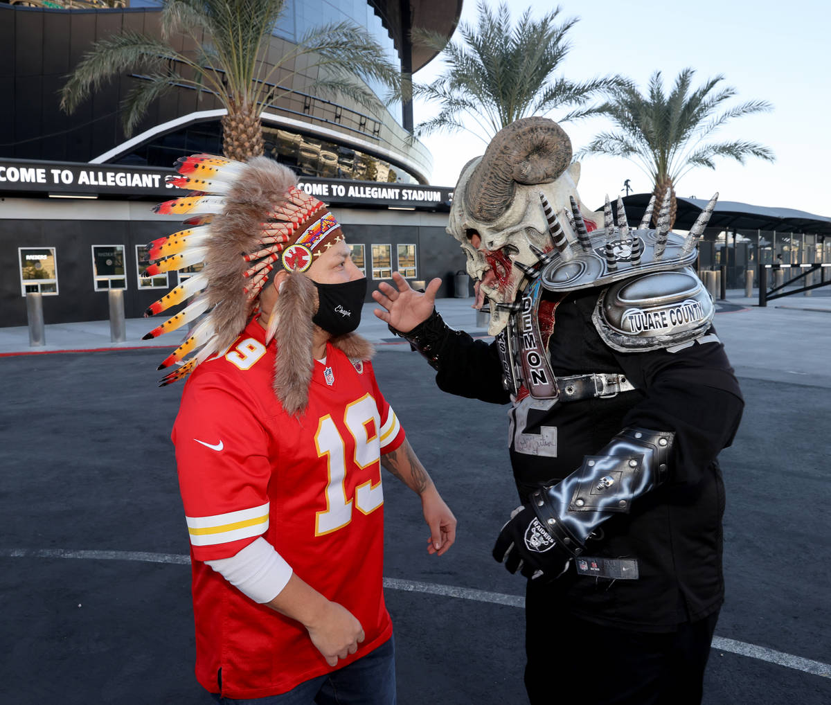 Kansas City Chiefs fan Oscar De Leon of Las Vegas, left, and Gabriel "Darkside Demon" ...