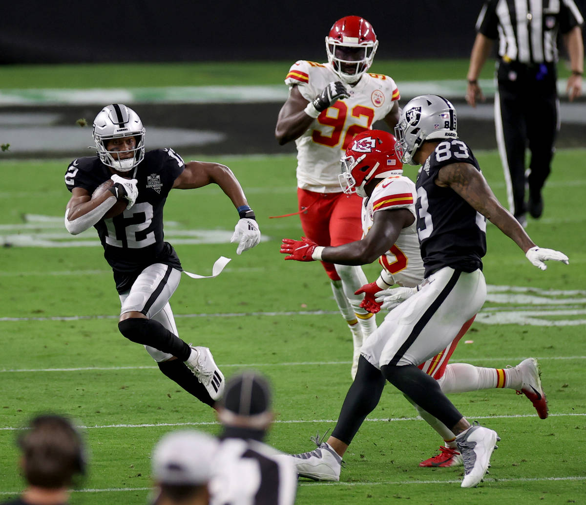 Las Vegas Raiders wide receiver Zay Jones (12) runs after catching a pass in the second quarter ...