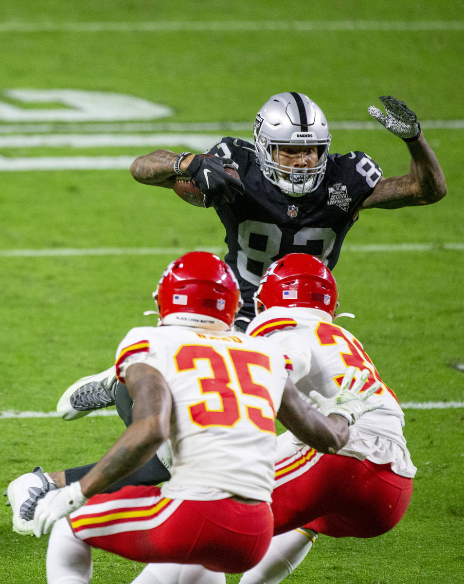 Las Vegas Raiders tight end Darren Waller (83) looks for more yards against Kansas City Chiefs ...