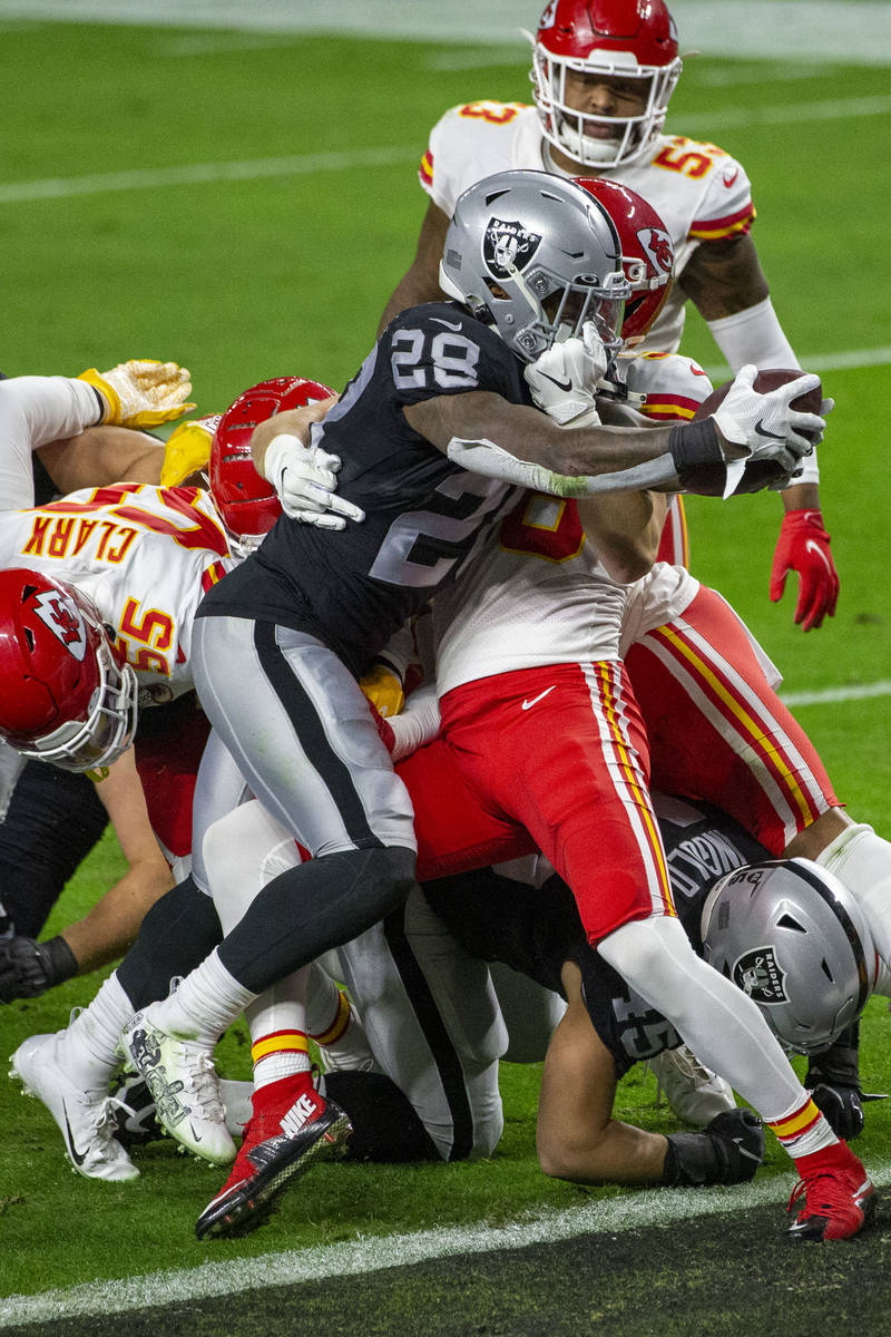 Las Vegas Raiders running back Josh Jacobs (28) scores a touchdown against the Kansas City Chie ...