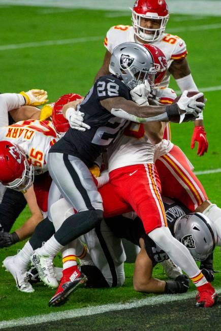 Las Vegas Raiders running back Josh Jacobs (28) scores a touchdown against the Kansas City Chie ...