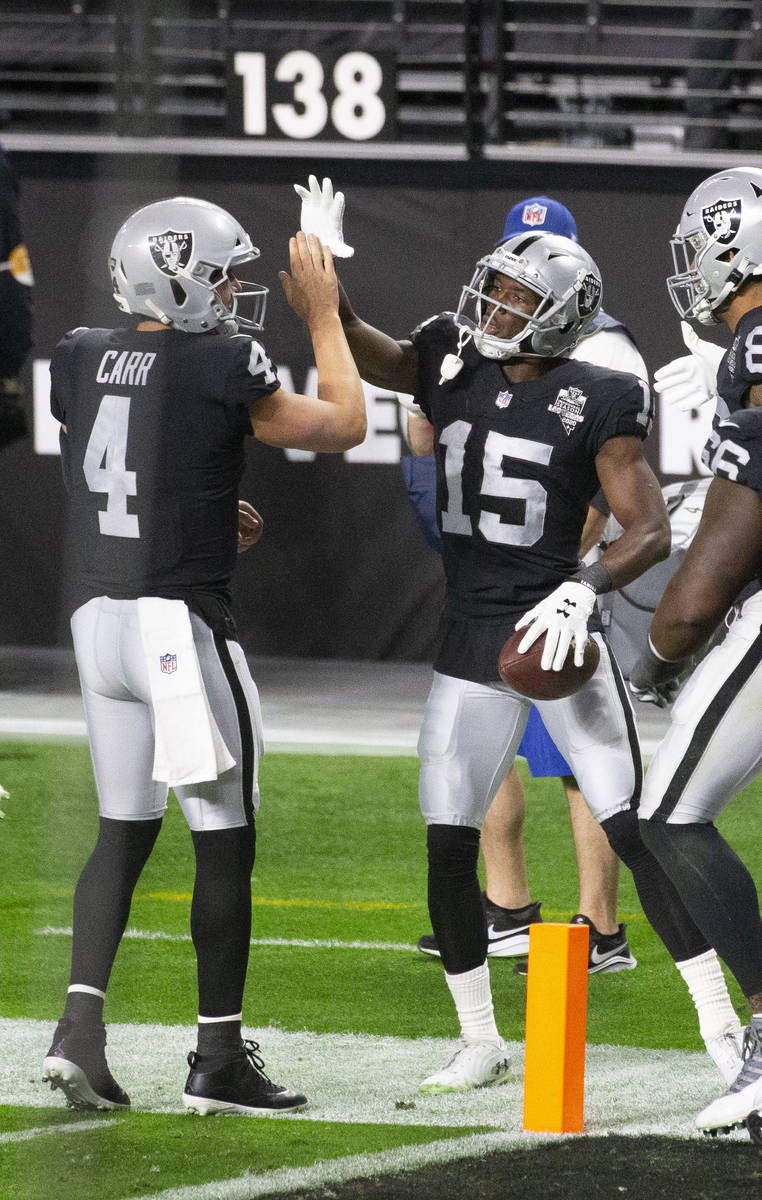 Las Vegas Raiders wide receiver Nelson Agholor (15) celebrates his touchdown score with quarter ...