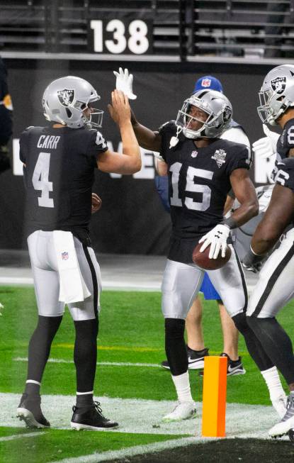 Las Vegas Raiders wide receiver Nelson Agholor (15) celebrates his touchdown score with quarter ...