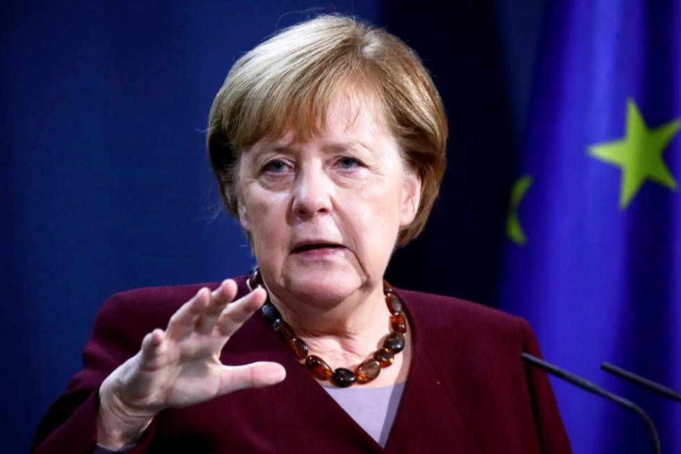 German Chancellor Angela Merkel holds a joint news conference with Finance Minister Olaf Scholz ...