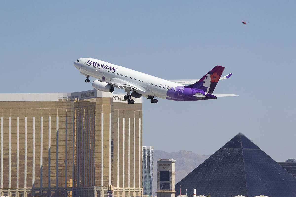 A Hawaiian Airlines jetliner departs from McCarran International Airport in Las Vegas in this J ...