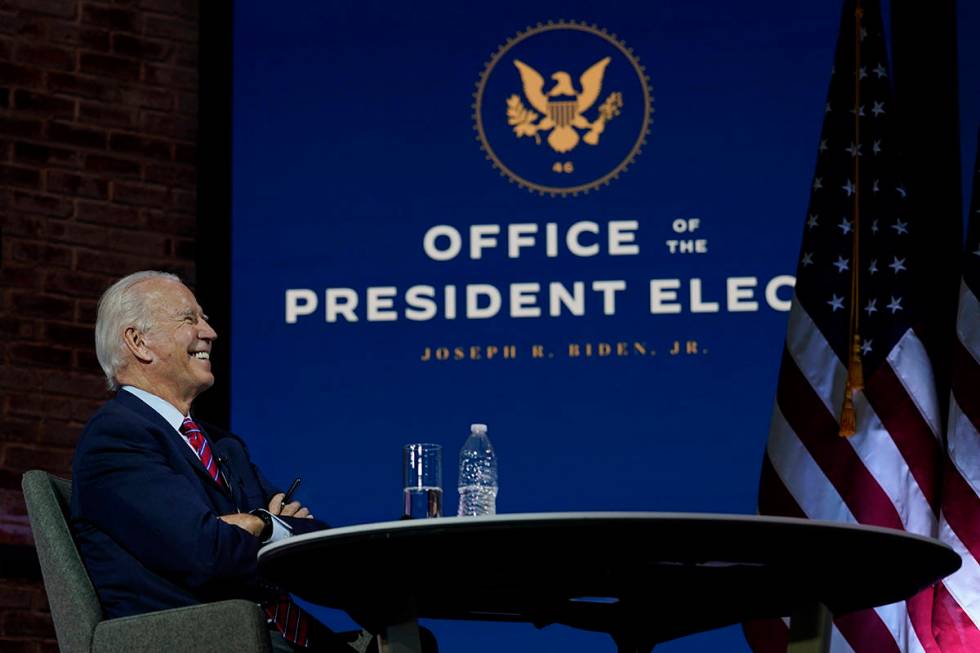 President-elect Joe Biden smiles as he meets virtually with the United States Conference of May ...