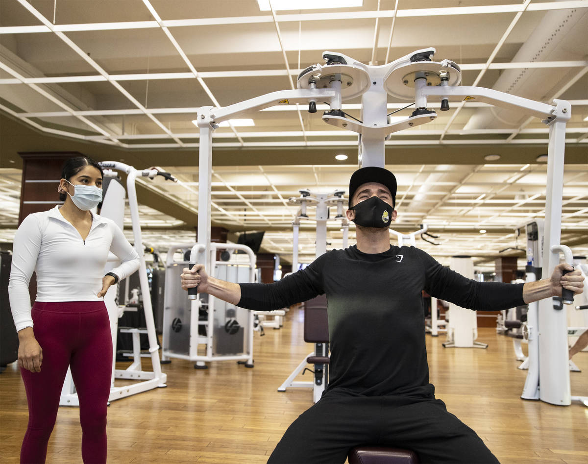 Travis Noone, right, works out with Alandra Ramirez at Life Time Athletic on Monday, Nov. 23, 2 ...