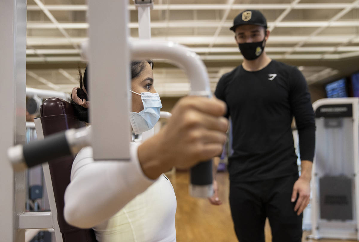 Alandra Ramirez, left, works out with Travis Noone at Life Time Athletic on Monday, Nov. 23, 20 ...