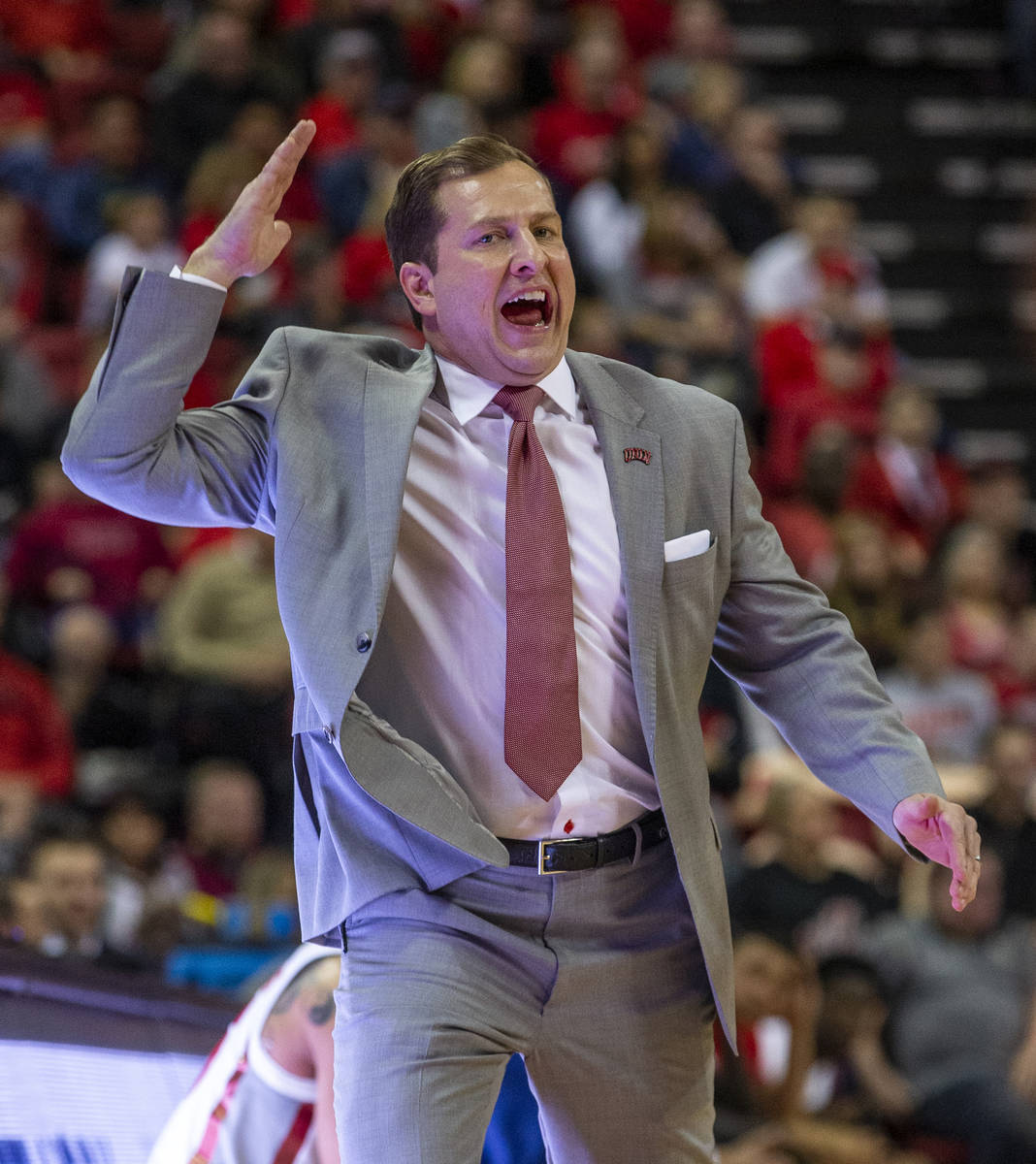 UNLV Rebels head coach T.J.Otzelberger yells in another play from the bench versus the San Dieg ...