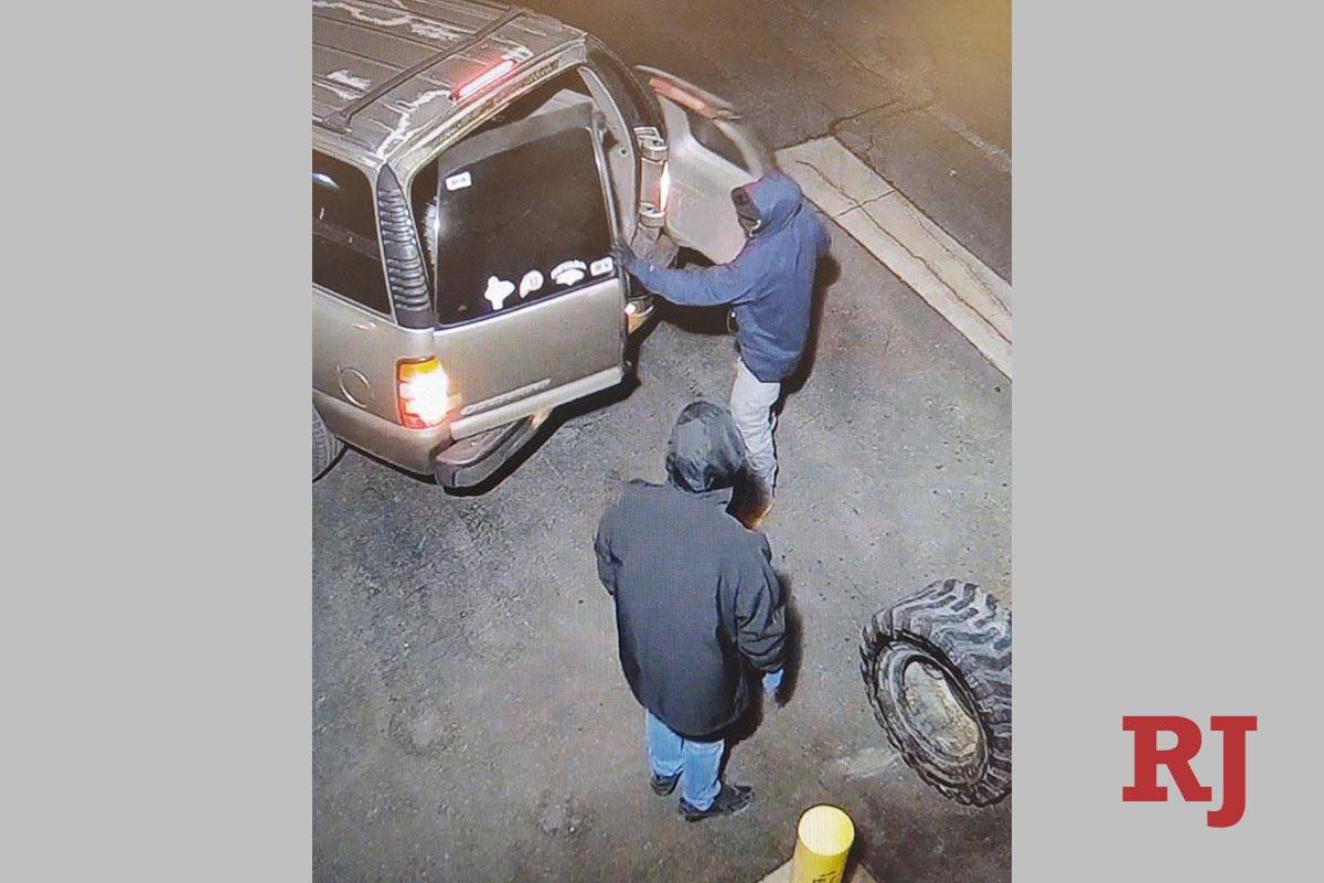 A surveillance photo shows two people at a burglary near South Jones Boulevard and West Sahara ...