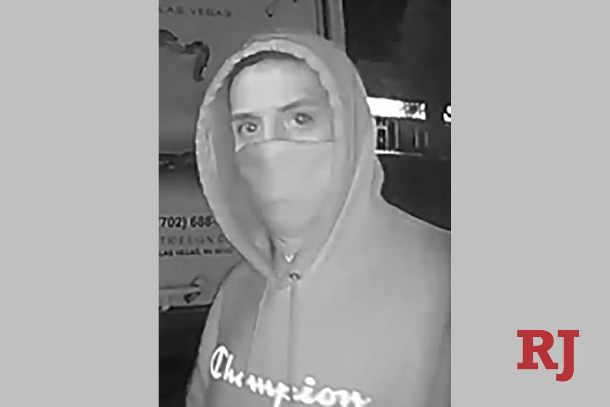 A surveillance photo of a man wanted in connection with a series of burglaries in the area of S ...