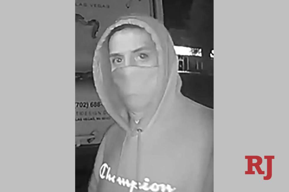 A surveillance photo of a man wanted in connection with a series of burglaries in the area of S ...